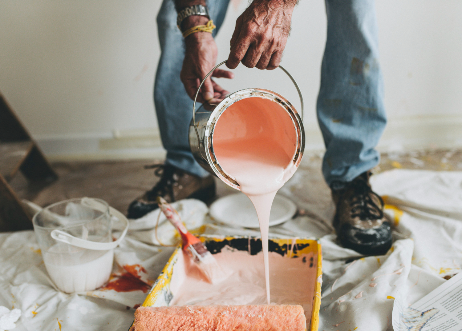 Professional painter repainting a house